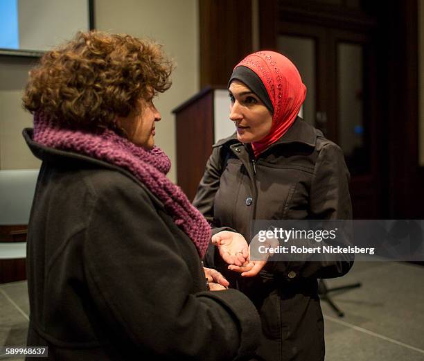 Executive Director of the Arab-American Association of New York Linda Sarsour speaks to an unidentified attendee during the 'Life after Surveillance...