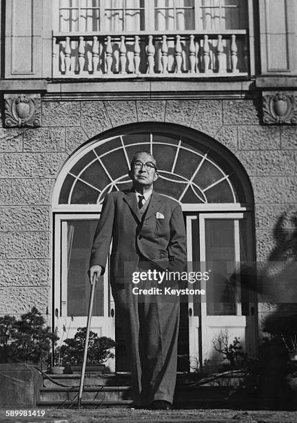 Japanese Prime Minister Ichiro Hatoyama takes a walk in the garden of his private residence in Tokyo, Japan, following the death of Taketora Ogata,...