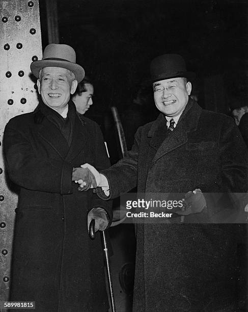 Japanese diplomat Ishii Kikujiro , Japan's special envoy to Europe, arrives at Victoria Station in London, and is greeted by Shigeru Yoshida , the...