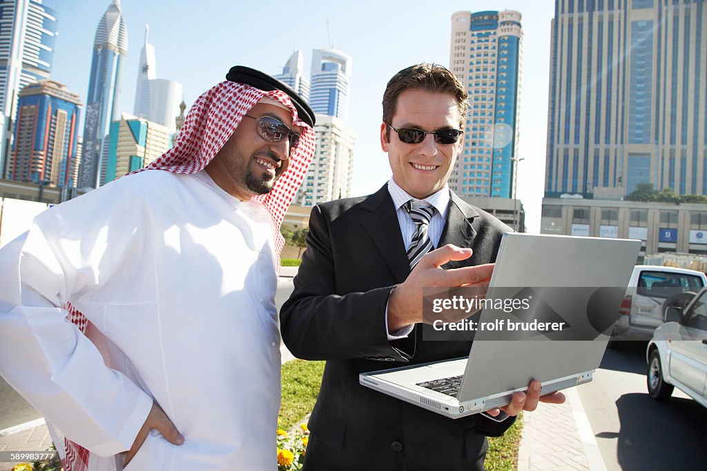 Businessmen Using Laptop in Dubai