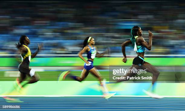 Shaunae Miller of the Bahamas runs on her way to winning the gold medal in the Women's 400m Final ahead of silver medalist Allyson Felix of the...