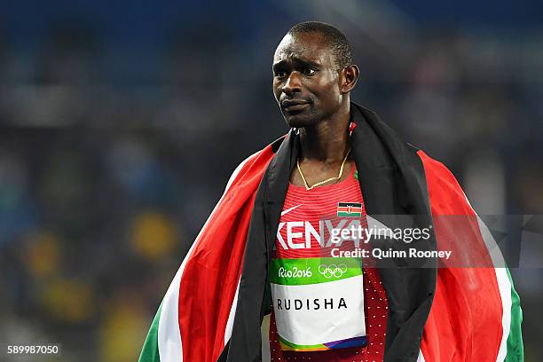 David Lekuta Rudisha of Kenya celebrates with the flag of Kenya after winning the gold medal in the Men's 800m Final on Day 10 of the Rio 2016...