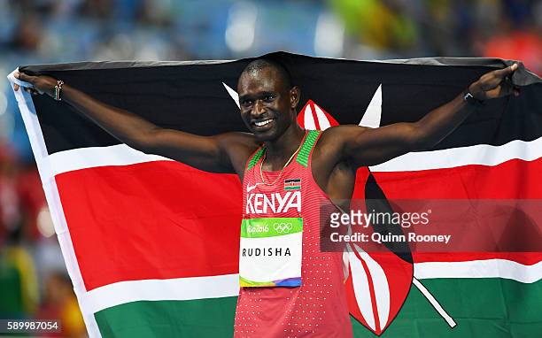 David Lekuta Rudisha of Kenya celebrates with the flag of Kenya after winning the gold medal in the Men's 800m Final on Day 10 of the Rio 2016...