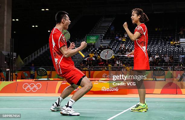 Ma Jin and Xu Chen of China celebrate during Badminton Mixed Doubles Quarter Final match against Ha Na Kim and Hyun Sung Ko of Korea on Day 9 of the...