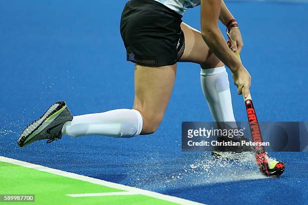 Agustina Albertarrio of Argentina centers the ball during the quarter final hockey game against Netherlands on Day 10 of the Rio 2016 Olympic Games...