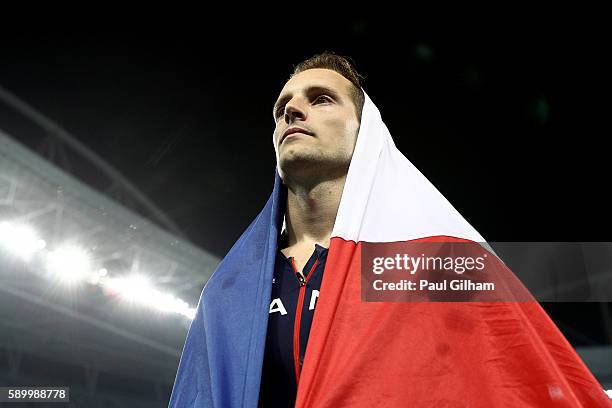 Renaud Lavillenie of France reacts after placing second in the Men's Pole Vault final on Day 10 of the Rio 2016 Olympic Games at the Olympic Stadium...