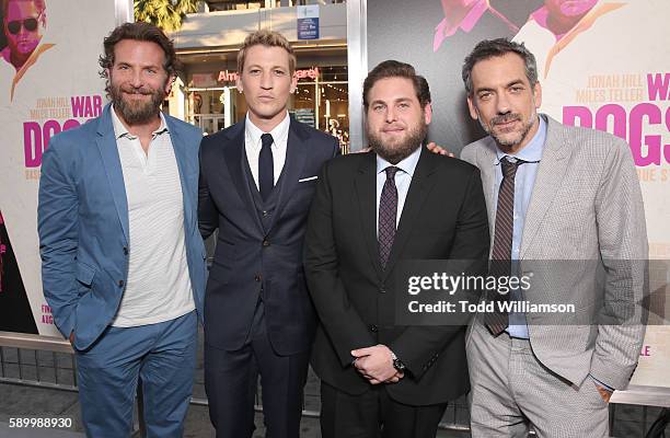 Bradley Cooper, Miles Teller, Jonah Hill and director/writer/producer Todd Phillips attend the premiere Of Warner Bros. Pictures' "War Dogs" at TCL...