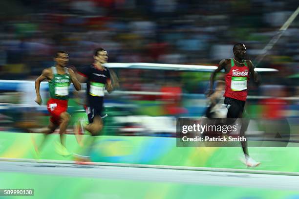 David Lekuta Rudisha of Kenya runs on his way to winning the gold medal ahead of silver medalist Taoufik Makhloufi of Algeria and bronze medalist...