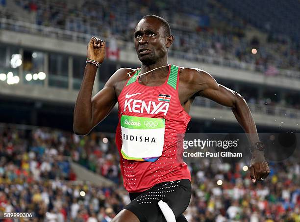 David Lekuta Rudisha of Kenya runs on his way to winning the gold medal ahead of silver medalist Taoufik Makhloufi of Algeria and bronze medalist...