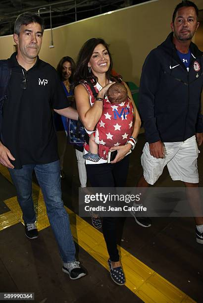 Nicole Johnson, fiancee of Michael Phelps, holding their baby son Boomer Phelps leaves the Stadium on day 8 of the Rio 2016 Olympic Games at Olympic...