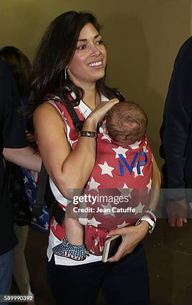 Nicole Johnson, fiancee of Michael Phelps, holding their baby son Boomer Phelps leaves the Stadium on day 8 of the Rio 2016 Olympic Games at Olympic...