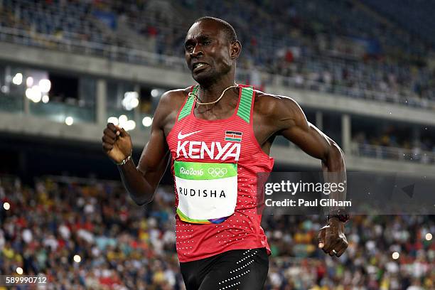 David Lekuta Rudisha of Kenya runs on his way to winning the gold medal ahead of silver medalist Taoufik Makhloufi of Algeria and bronze medalist...