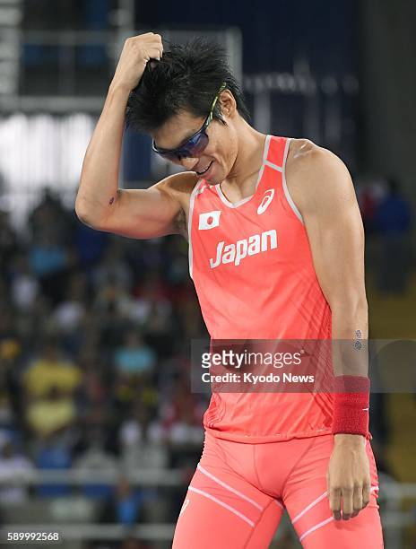 Japan's Daichi Sawano reacts after his unsuccessful attempt to clear 5.65 meters during the men's pole vault final at the Rio de Janeiro Olympics on...