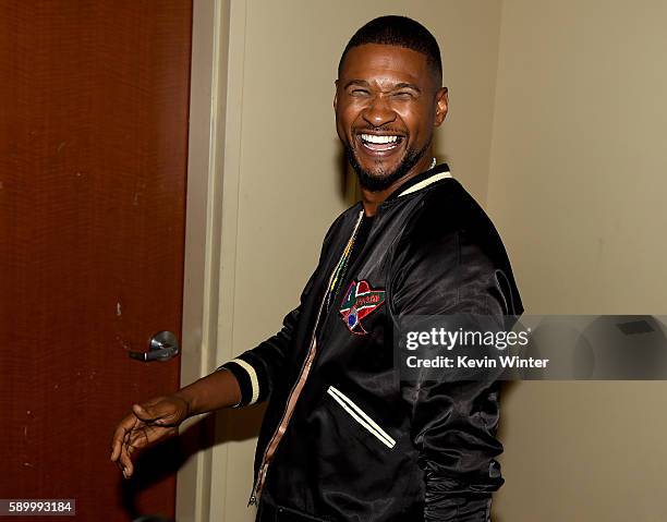 Actor/singer Usher Raymond arrives at a screening of the Weinstein Company's "Hands of Stone" at the Pacific Theatres at The Grove on August 15, 2015...