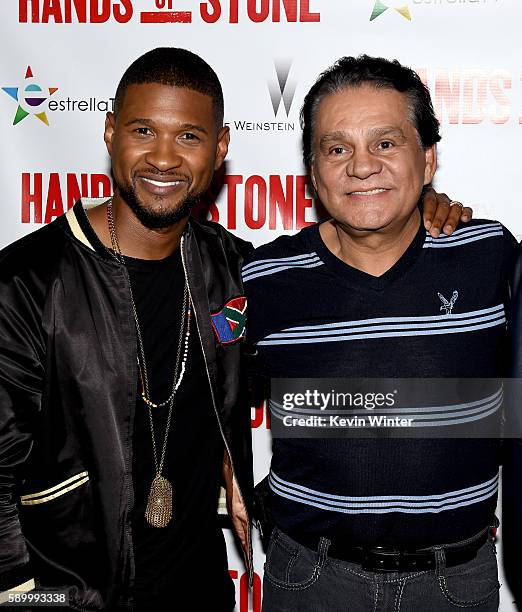 Actor/singer Usher Raymond and former professional boxer Roberto Duran arrive at a screening of the Weinstein Company's "Hands of Stone" at the...