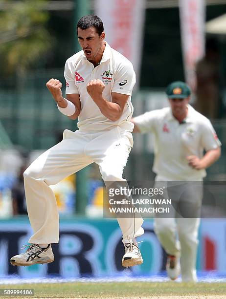 Australia's Mitchell Starc celebrates after he dismissed Sri Lankan batsman Kusal Mendis during the fourth day of the third and final Test cricket...