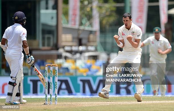 Australia's Mitchell Starc celebrates after he dismissed Sri Lankan batsman Kusal Mendis during the fourth day of the third and final Test cricket...