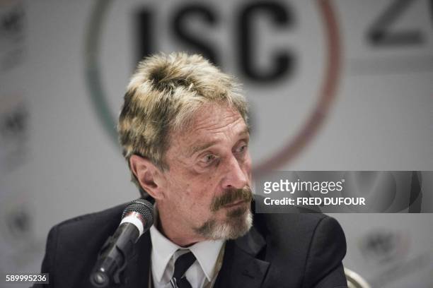 John McAfee, founder of the eponymous anti-virus company, speaks to journalists at the China Internet Security Conference in Beijing on August 16,...