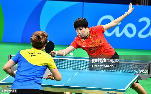 Li Xiaoxia of China competes against Feng Tianwei of Singapore in the Womens Team Semifinal 1 on Day 10 of the 2016 Rio Olympics at Riocentro -...