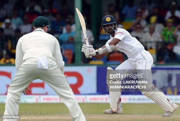 Sri Lanka's Dinesh Chandimal plays a shot during the fourth day of the third and final Test cricket match between Sri Lanka and Australia at The...