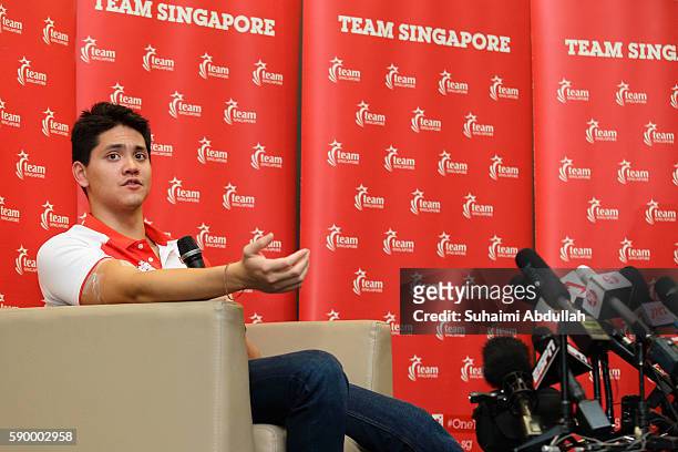 Singaporean Swimmer Joseph Schooling speaks to the media during a press conference at the OCBC Aquatic Centre on August 16, 2016 in Singapore....