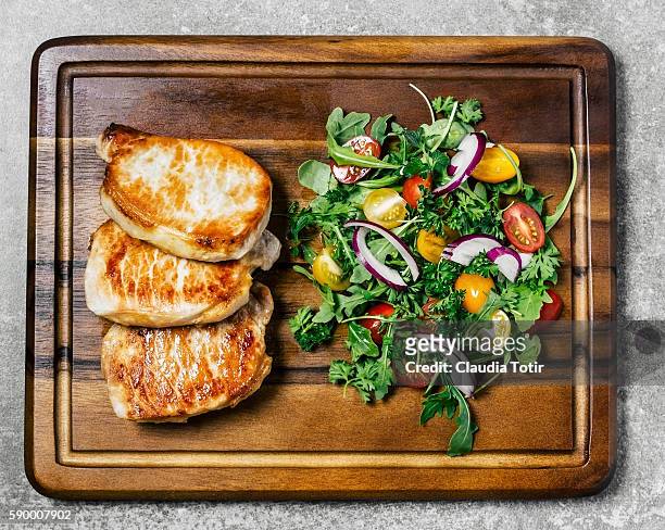 roasted pork chops with salad - paleo diet stock pictures, royalty-free photos & images
