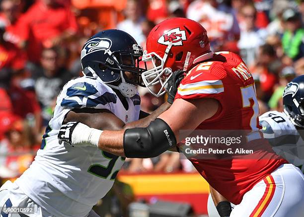 Defensive end Quinton Jefferson of the Seattle Seahawks rushes against offensive tackle Eric Fisher of the Kansas City Chiefs during the first half...