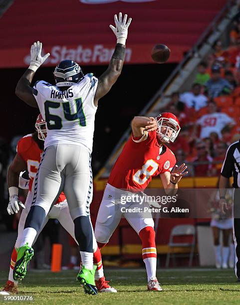 Quarterback Kevin Hogan of the Kansas City Chiefs throws a pass against pressure from defensive tackle DeAngelo Tyson of the Seattle Seahawks during...