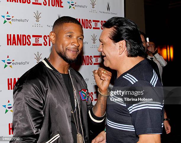 Usher Raymond and Roberto Duran attend the screening of 'Hands of Stone' at Pacific Theatres at The Grove on August 15, 2016 in Los Angeles,...