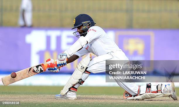 Sri Lanka's Kaushal Silva plays a shot during the fourth day of the third and final Test cricket match between Sri Lanka and Australia at The...