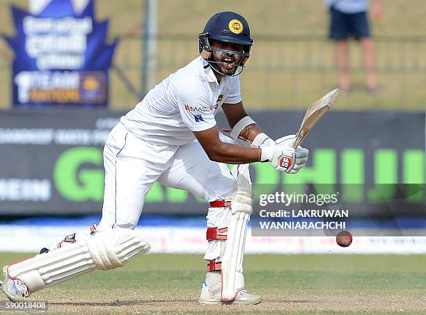 Sri Lanka's Dinesh Chandimal plays a shot during the fourth day of the third and final Test cricket match between Sri Lanka and Australia at The...