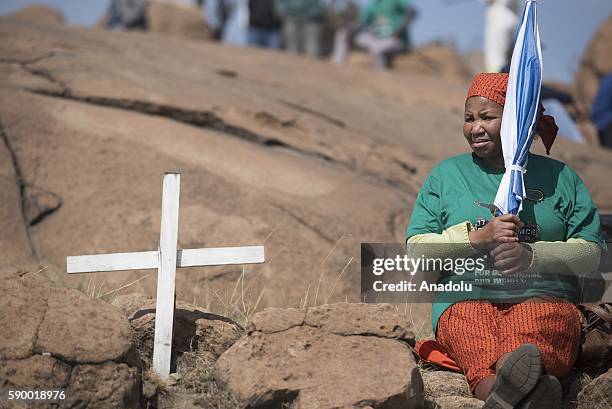 Members of the Association of Mineworkers and Construction Union dance and sing around Wonderkop Hill during the 4th anniversary of the Marikana...