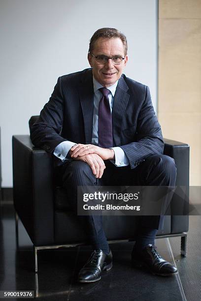 Andrew Mackenzie, chief executive officer of BHP Billiton Ltd., poses for a photograph after presenting the company's full-results to the media in...