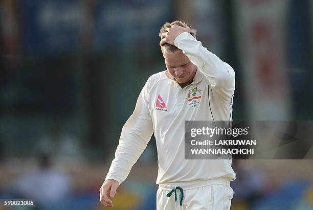 Australia's captain Steven Smith reacts during the fourth day of the third and final Test cricket match between Sri Lanka and Australia at The...