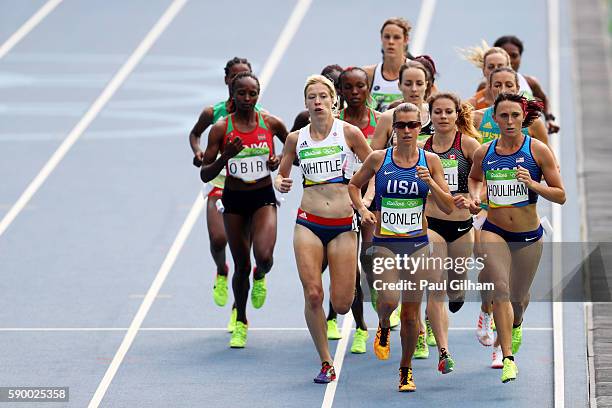 Laura Whittle of Great Britain, Kim Conley of the United States, and Shelby Houlihan of the United States lead the pack during the Women's 5000m...