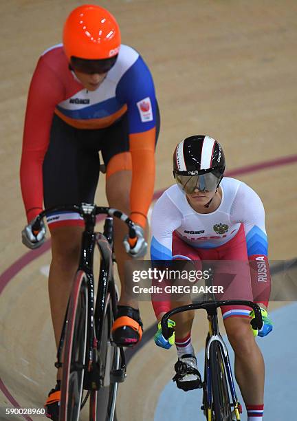 Netherlands' Elis Ligtlee races Russia's Anastasiia Voinova during the Women's sprint quarter-finals track cycling event at the Velodrome during the...