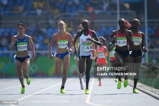 S Shelby Houlihan, Netherlands' Susan Kuijken, Turkey's Yasemin Can, Kenya's Helen Obiri and Kenya's Mercy Cherono compete in the Women's 5000m Round...