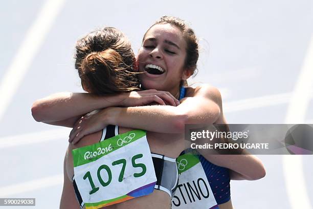 New Zealand's Nikki Hamblin hugs USA's Abbey D'agostino after they competed in the Women's 5000m Round 1 during the athletics event at the Rio 2016...