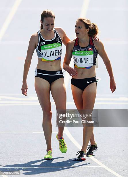 Lucy Oliver of New Zealand and Jessica O'Connell of Canada react after the Women's 5000m Round 1 - Heat 1 on Day 11 of the Rio 2016 Olympic Games at...