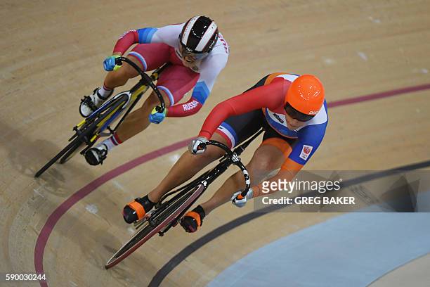 Netherlands' Elis Ligtlee races Russia's Anastasiia Voinova during the Women's sprint quarter-finals track cycling event at the Velodrome during the...