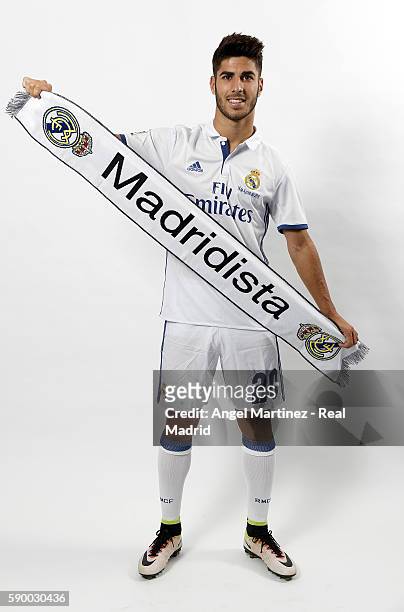 Marco Asensio of Real Madrid poses during his official presentation at Estadio Santiago Bernabeu on August 16, 2016 in Madrid, Spain.