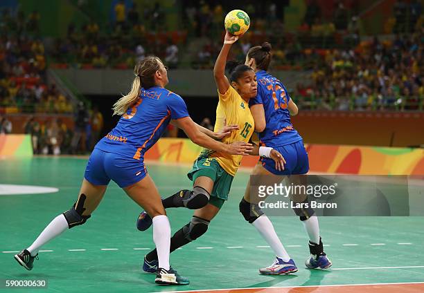 Francielle Rocha of Brazil is challenged by Lois Abbingh of Netherlands and Yvette Broch of Netherlands during he Womens Quarterfinal match between...