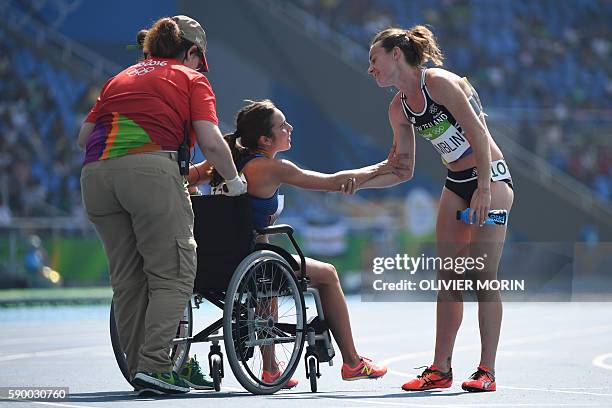 S Abbey D'agostino leaves the track on a wheelchair after competing in the Women's 5000m Round 1 during the athletics event at the Rio 2016 Olympic...