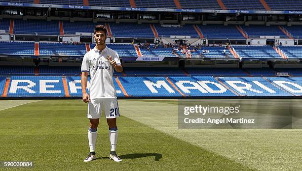 Marco Asensio of Real Madrid poses during his official presentation at Estadio Santiago Bernabeu on August 16, 2016 in Madrid, Spain.