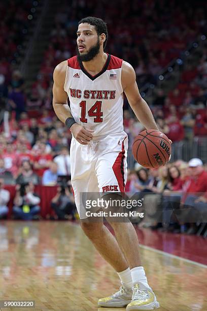 Caleb Martin of the North Carolina State Wolfpack moves the ball against the Miami Hurricanes at PNC Arena on January 30, 2016 in Raleigh, North...