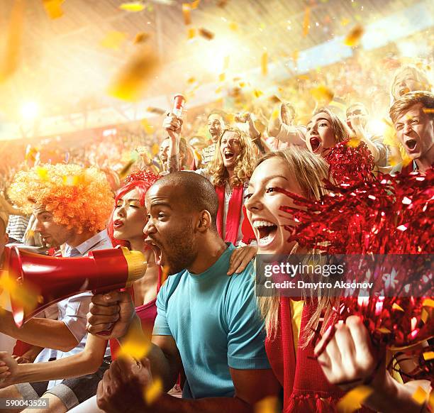 sport fans: group of cheering fans - rugby stadium stock pictures, royalty-free photos & images