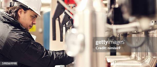 stationary engeneer at work - heating engineer stock pictures, royalty-free photos & images