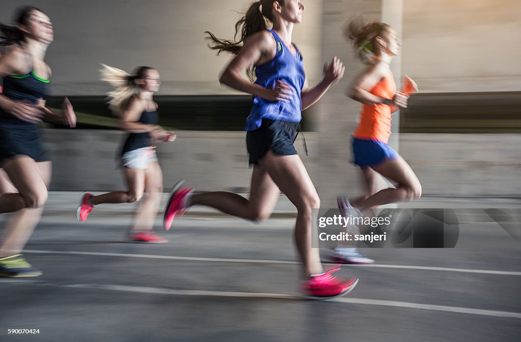 Group of young woman running outdoors