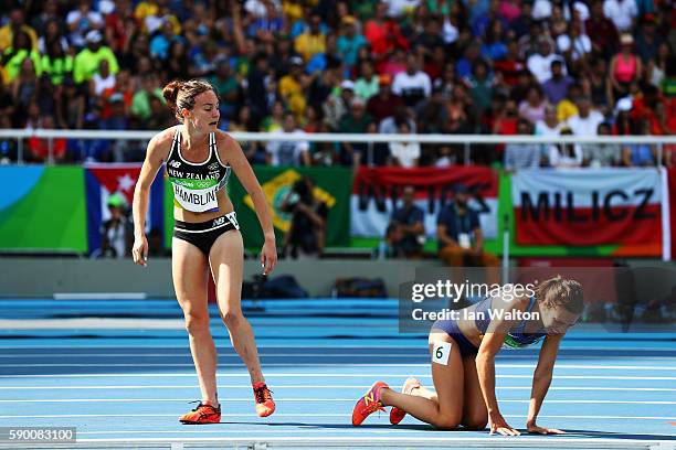 Abbey D'Agostino of the United States and Nikki Hamblin of New Zealand react after a collision during the Women's 5000m Round 1 - Heat 2 on Day 11 of...