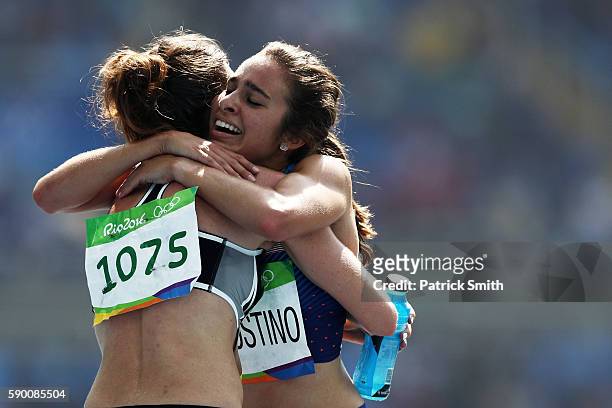 Abbey D'Agostino of the United States hugs Nikki Hamblin of New Zealand after the Women's 5000m Round 1 - Heat 2 on Day 11 of the Rio 2016 Olympic...